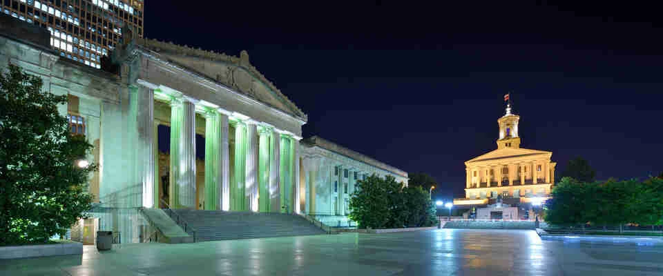Nashville War Memorial Auditorium and Tennessee State Capitol in Nashville, Tennessee, USA.