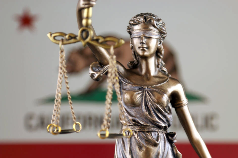 Symbol of law and justice with California State Flag. Close up.
