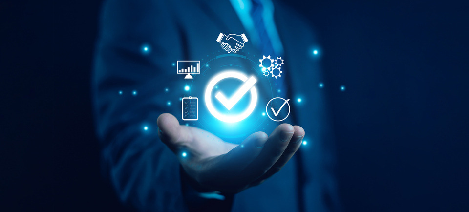 Hand shows a checkmark - symbolizing compliance