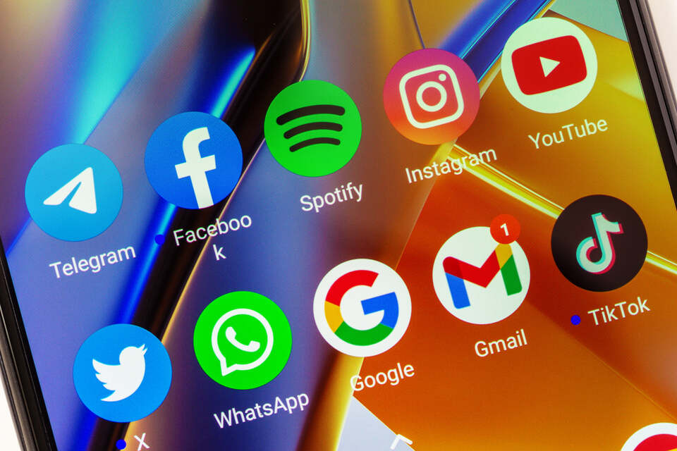 telegram, facebook, spotify, instagram, youtube, twitter, whatsapp, google, gmail, tik tok mobile app icons on a mobile screen