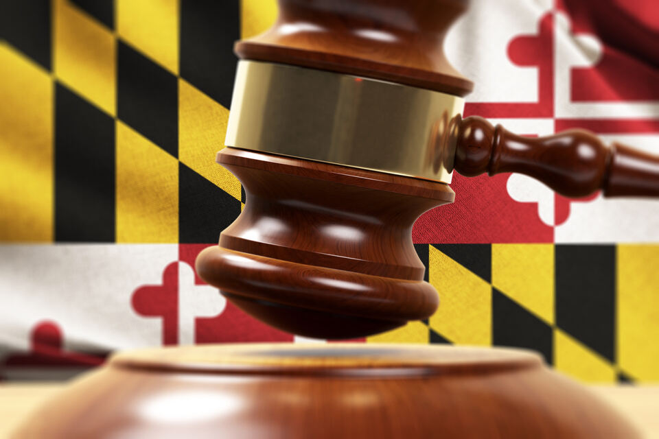Wood Gavel Standing Front Of the Maryland State Flag