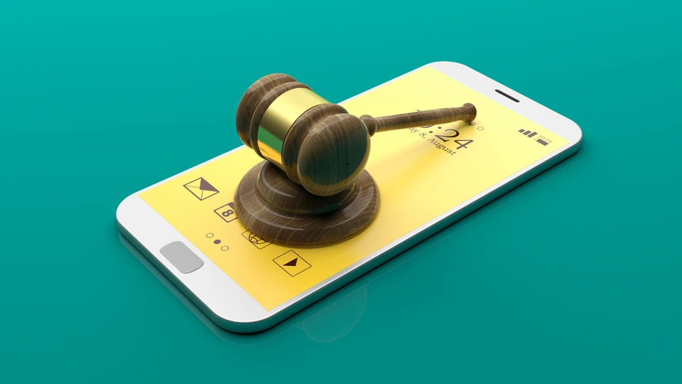 Judge’s gavel on a smartphone representing an app-related legal case