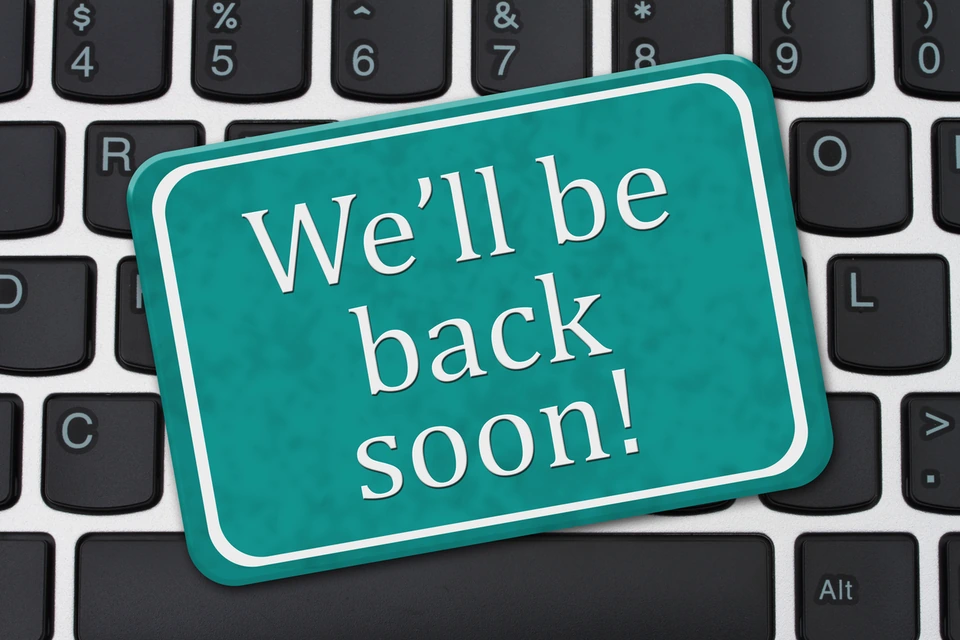 We’ll be back soon sign on a computer keyboard